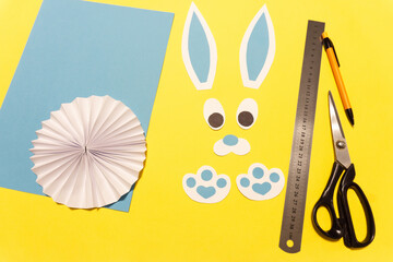 How to make a paper rabbit, bunny for Easter greetings. DIY children's art project. DIY concept. Step 10. Collect ready-made ears, nose and paws