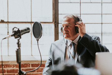Businessman recording a podcast