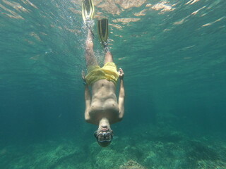underwater man snorkeling in the sea withcrystal-clear waters concept of holiday relax summer beach...