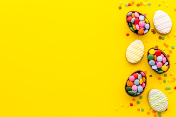 Happy Easter with chocolate eggs and sweets. Space for text