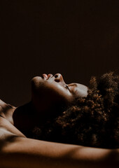 Naklejka premium Black woman with closed eyes