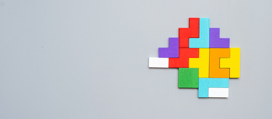 geometric shape block with colorful wood puzzle piece background. logical thinking, business logic,...