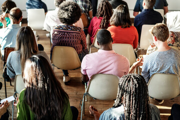 Group of people sitting on a chair