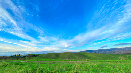 Green hill in Tuscany, Italy. Panorama. Trevel and tourism. Rural countryside.
