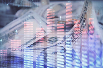 Double exposure of forex graph drawing over us dollars bill background. Concept of financial markets.