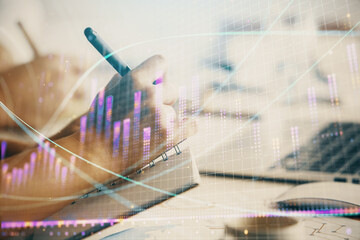 Naklejka premium Double exposure of forex graph drawing over people taking notes background. Concept of financial analysis