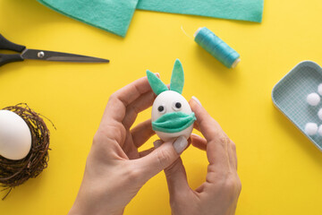 How to make felt bunny for Easter decor and fun.  DIY concept. Step by step photo instruction. Step 13. We glue the ears to the bunny.
