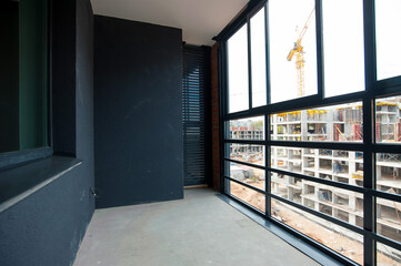 glazed balcony and decorative plaster in the new house