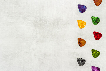 Guitar picks pattern. top view. Music background
