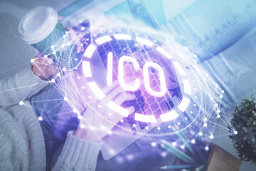 Double exposure of woman hands typing on computer and crypto market theme hologram drawing. Blockchain concept.