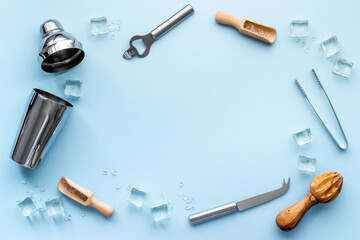 Top view of bar accessories with a cocktail shaker