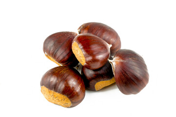 Ripe chestnuts close up. Raw Chestnuts for Christmas. Fresh sweet chestnut. Castanea sativa top wiew. Food background.
