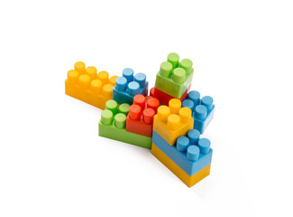 Children toys; colorful plastic blocks on the white background.
