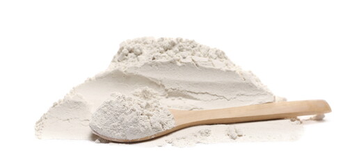 Rye flour pile with wooden spoon isolated on white background