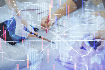 Double exposure of business theme drawing and man and woman working together holding and using a mobile device.