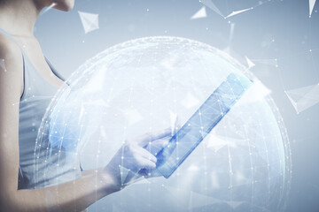 Double exposure of business theme sketch hologram and woman holding and using a mobile device.