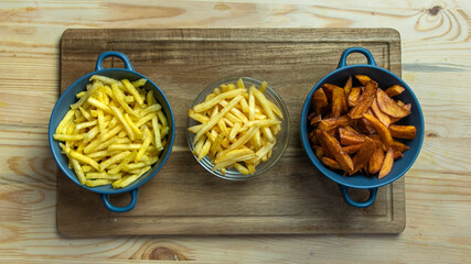 comparison of three servings of fries. Semi-finished product from the store. Handmade at home. Bought at McDonald's.