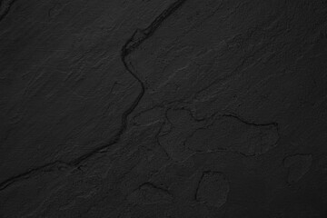 Dark grey black slate background or texture. Black granite slabs background