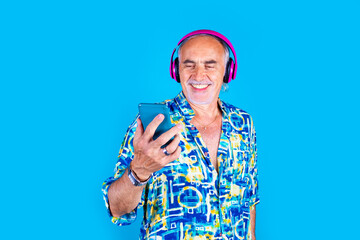 Senior caucasian man using smartphone listening playlist streaming