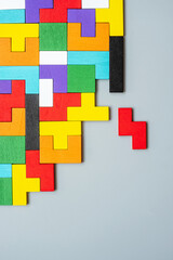 geometric shape block with colorful wood puzzle piece background. logical thinking, business logic,...