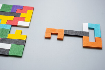 Key and keyhole shape of geometric colorful wood puzzle pieces. logical thinking, business logic,...