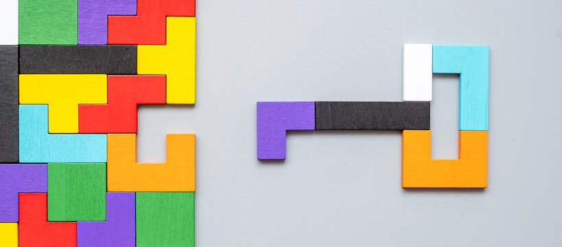 Key and keyhole shape of geometric colorful wood puzzle pieces. logical thinking, business logic, Conundrum, decision, solutions, rational, mission, success, goals and strategy concepts