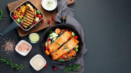 Homemade fresh salmon with starter and vegetables on dark background