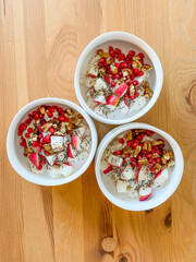 Oatmeal Porridge Bowl with Apple slices, Chia Seeds, Honey and Walnut.