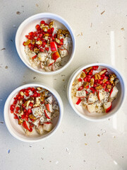 Oatmeal Porridge Bowl with Apple slices, Chia Seeds, Honey and Walnut.