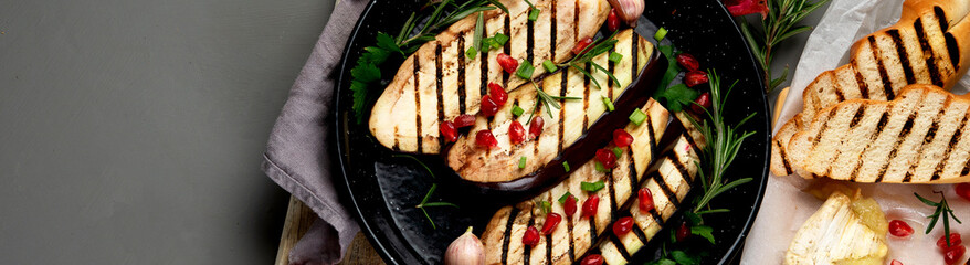 Grilled eggplant slices on a pan