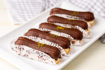 Traditional french eclairs with chocolate.