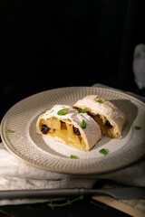 Close up of apple austrian strudel with cinnamon on a plate