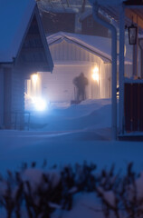 a man in the snow blast in the dark evening