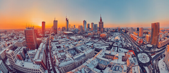 Beautiful panoramic aerial drone view on Warsaw City Skyscrapers, PKiN, and Varso Tower under...