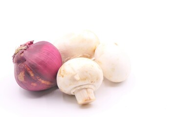 Red onion and mushrooms isolated at a white background high key