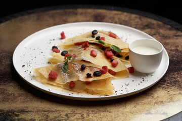 Crepes, apple pancake or caramelized apple crepe with yoghurt cream