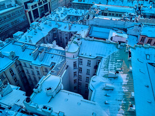 Beautiful panoramic aerial drone view on Warsaw City Skyscrapers, PKiN, and Varso Tower under construction and 19th-century tenement houses during the January sunset, Warsaw, Poland.