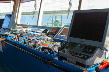 This is a ship's bridge. Inside view of the bridge like you are the captain of the ship.