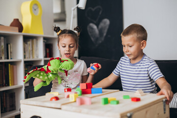 happy young children play at home