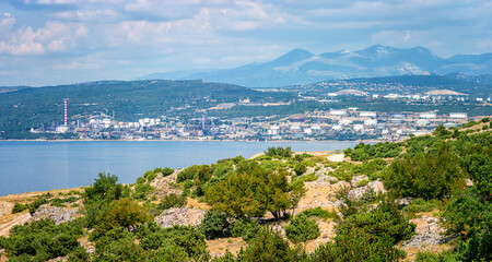 Fototapeta na wymiar Oil refinery near Rijeka, Croatia. Summer landscape and industrial panoramic view