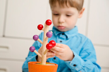 wooden tree game. concentration on attention, movement coordination, patience development, focus workout. Montessori type toy