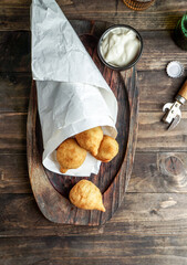 coxinha - popular food in Brazil consisting of chopped or shredded chicken meat covered in dough