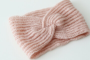Fototapeta na wymiar women hand knitted pink wool headband