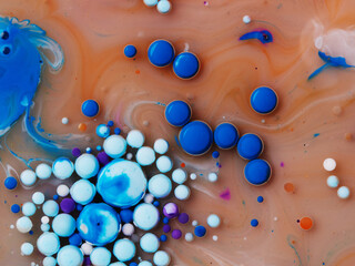 abstract background oil drops on water macro orange