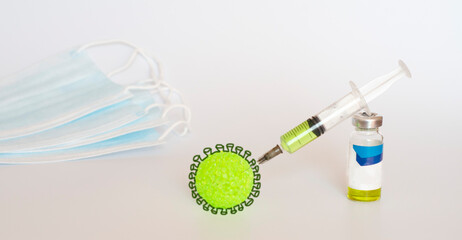 Creative Breakthrough in the Creating of a COVID-19 Vaccine. The medical concept. Ampoule and syringe.