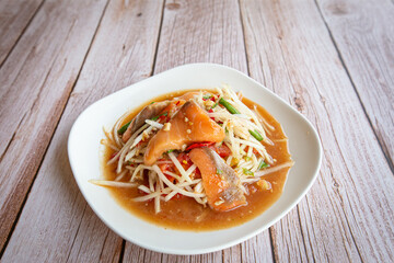 Close up of Spicy Papaya Salad with Salmon.