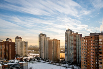 Fototapeta na wymiar Beautiful motion blurred sky over high-rise building in the city