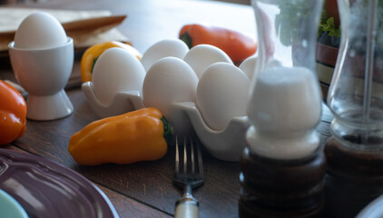 Eggs and sweet peppers on the table. Home kitchen. Soft focus on the background. Still life