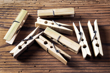 Clothespins on wooden background