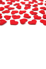 Valentines day background. Red bright hearts isolated on white background. Valentines day concept. Valentines card with red hearts. Valentines pattern. Copy space for your text.